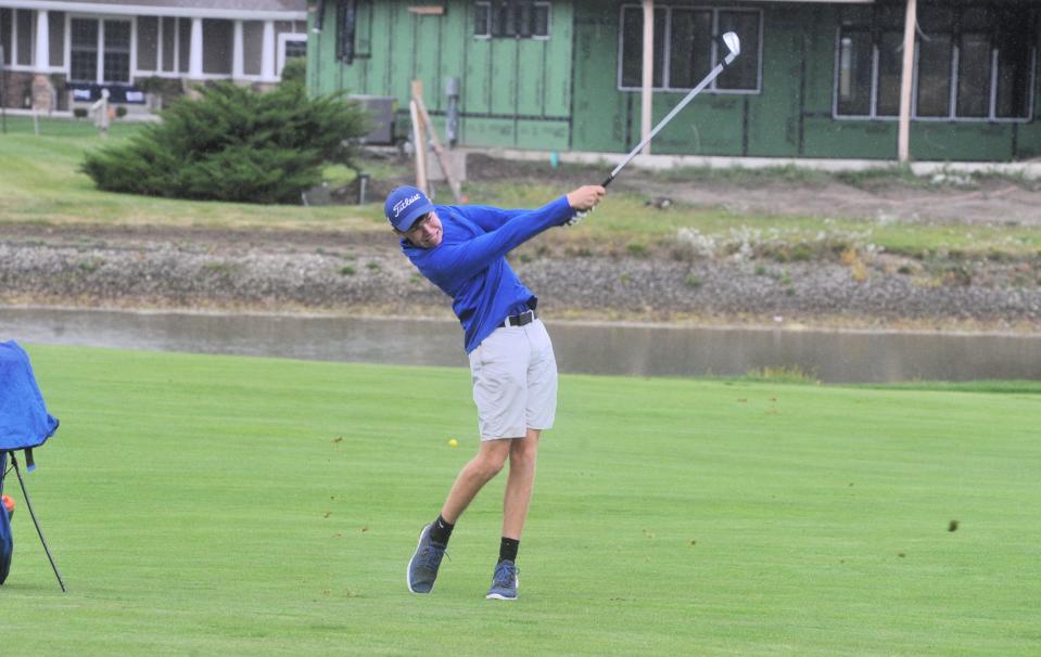 Wynford's Dawson Pelter hits an approach shot on No. 9 at Stone Ridge in the Division III district tournament.