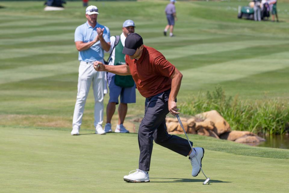 Tony Romo reacts after sinking the winning putt on the 18th hole during the final round of the American Century Celebrity Championship golf tournament at Edgewood Tahoe Golf Course in Stateline, on  Sunday, July 10, 2022. (AP Photo/Tom R. Smedes)