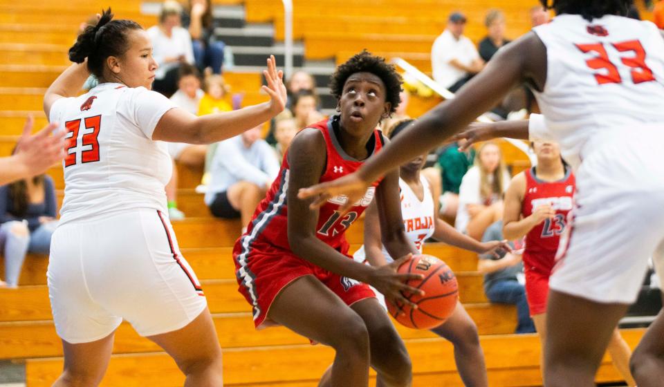 Evangelical Christian School's Jarcerriya Jenkins (13) looks for the basket during the Barron Collier Thanksgiving girls basketball tournament on Wednesday, Nov. 24, 2021 at Barron Collier High School in Naples, Fla. 