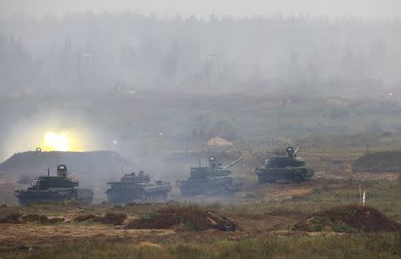 Tanks and an armoured vehicle take part in the Zapad 2017 war games at a range near the town of Borisov, Belarus September 20, 2017. REUTERS/Vasily Fedosenko