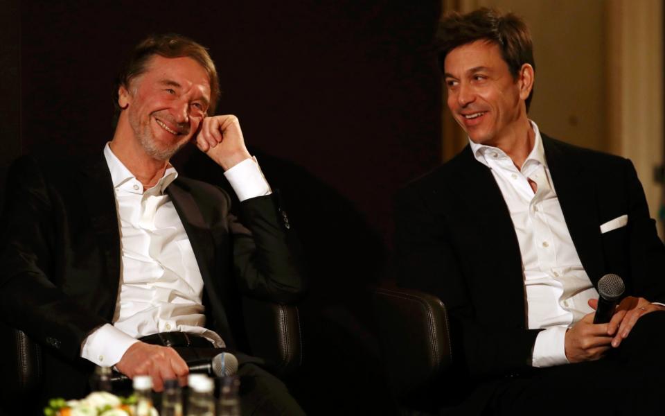 INEOS founder and chairman Sir Jim Ratcliffe (left) and Toto Wolff, team principal and CEO of the Mercedes AMG-PETRONAS F1 team (right), react during a press conference on the future partnership between INEOS and Mercedes at the Royal Automobile Club on February 10, 2020. in London