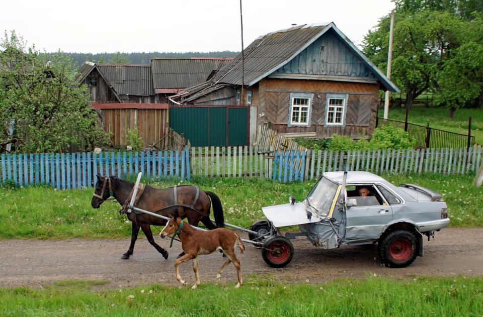 Belarusian shepherd Alexey Usikov, 33, drives a horse-drawn carriage, equipped with a battery, head lights, small potbelly stove, which he crafted out of an old Audi-80 calling it jokingly Audi-40 as he used only a half of the car, in the village of Knyazhytsy, Belarus May 28, 2020.