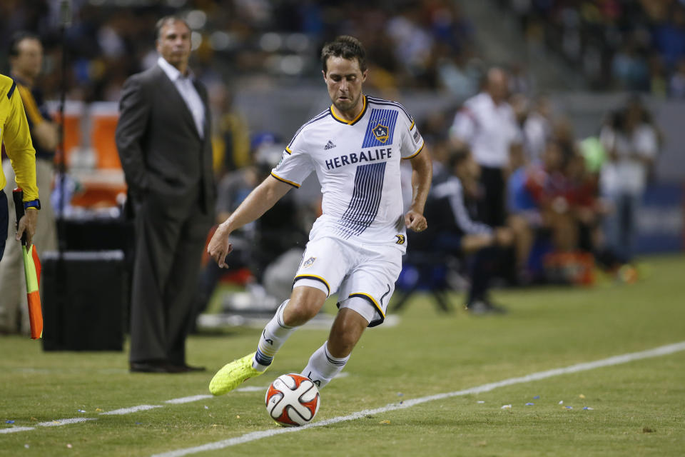 FILE - In this Aug. 27, 2014, file photo, Los Angeles Galaxy's Todd Dunivant plays the ball during an MLS soccer match against D.C. United in Carson, Calif. Dunivant, now president and general manager of the Sacramento Republic FC, along with his staff and players are preparing for the upcoming USL season to start in May and continuing the work on moving forward with the club’s Major League Soccer expansion plans. (AP Photo/Danny Moloshok, File)