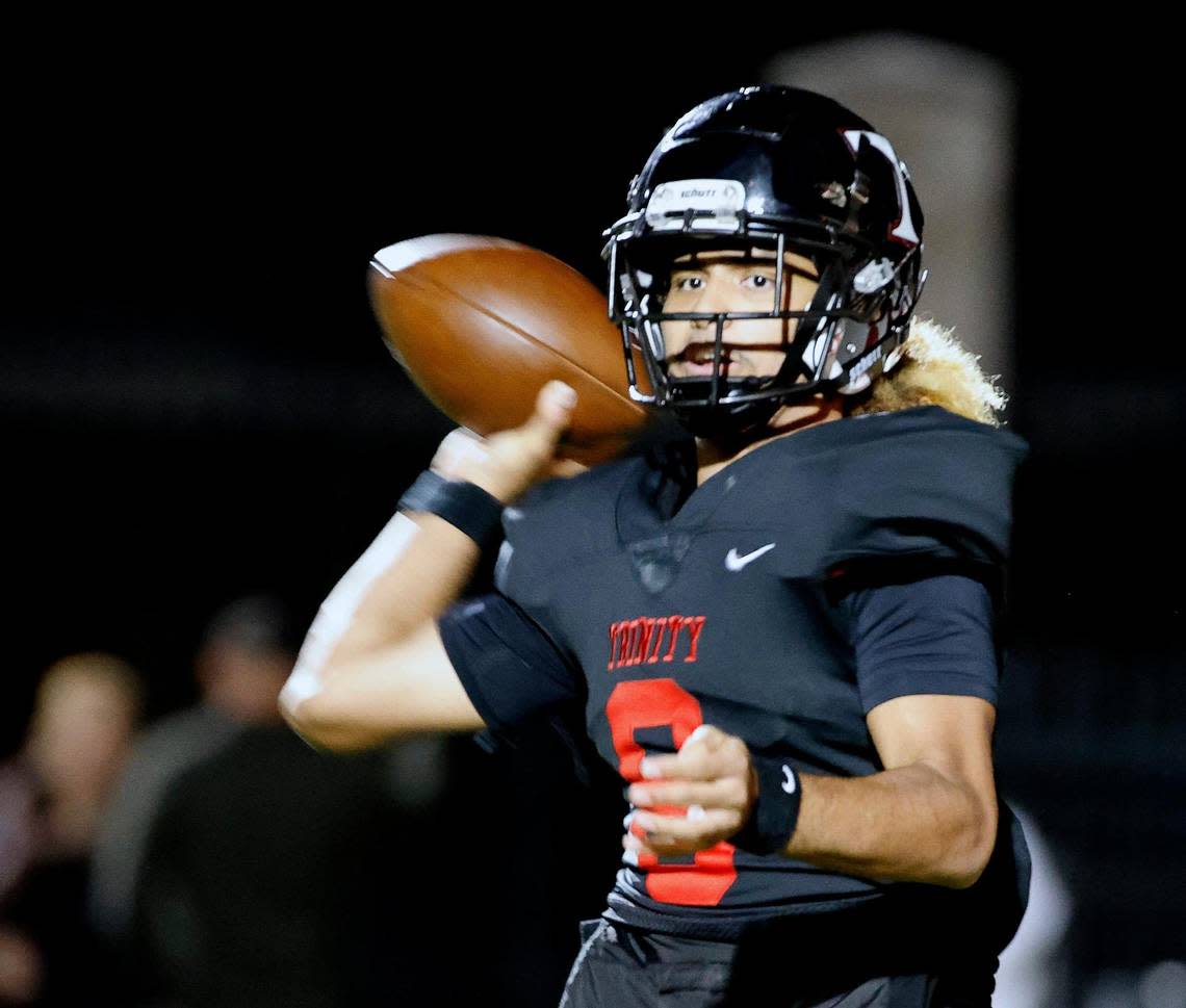 Trinity quarterback TJ Tupou (8) tosses to the outside in the second half of a UIL Class 6A Division 1 bi-district playoff football game at Pennington Field in Bedford, Texas, Friday, Nov. 10, 2023. Trinity moves on in the playoffs after defeating Timber Creek 63-35.