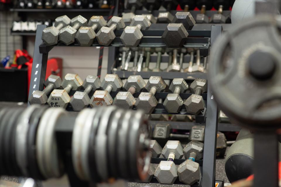 Used dumbbells, free weights, kettle bells and other weightlifting equipment are seen for sale at Play It Again Sports.