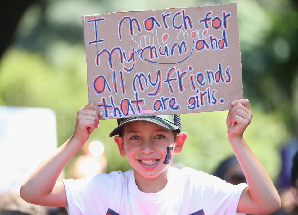 Protesters hold up banners in Hyde Park on January 21, 2017 in Sydney, Australia.&nbsp;