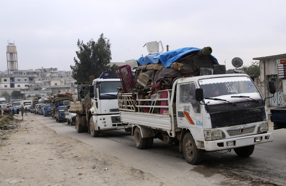 Syrians drive through the city of al-Mastouma, in Idlib province, as they flee a government offensive, Tuesday, Jan. 28, 2020. Syrian government forces have been on the offensive for more than a month in the northwestern Idlib province, the last rebel stronghold in the country. But in recent days, the government captured more than a dozen villages in the area as the insurgents' defenses began to crumble. (AP Photo/Ghaith Alsayed)