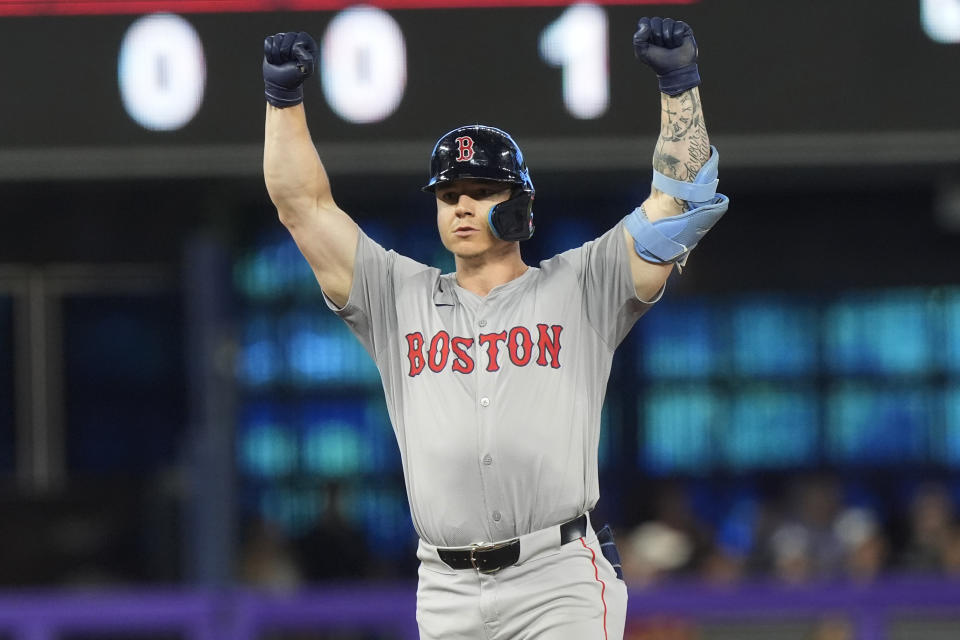 Boston Red Sox's Tyler O'Neill gestures after hitting a double to bring in a run during the 12th inning of a baseball game against the Miami Marlins, Thursday, July 4, 2024, in Miami. (AP Photo/Marta Lavandier)