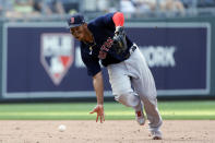 Boston Red Sox third baseman Rafael Devers attempts to bare-hand a ground ball hit by Kansas City Royals' Kelvin Gutierrez during the ninth inning of a baseball game at Kauffman Stadium in Kansas City, Mo., Saturday, June 19, 2021. Gutierrez singled on the play. (AP Photo/Colin E. Braley)