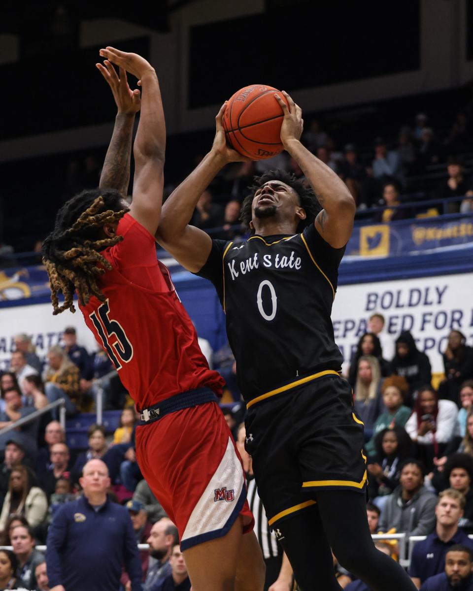Kent State guard Julius Rollins drives to the basket during Monday's game against Malone.