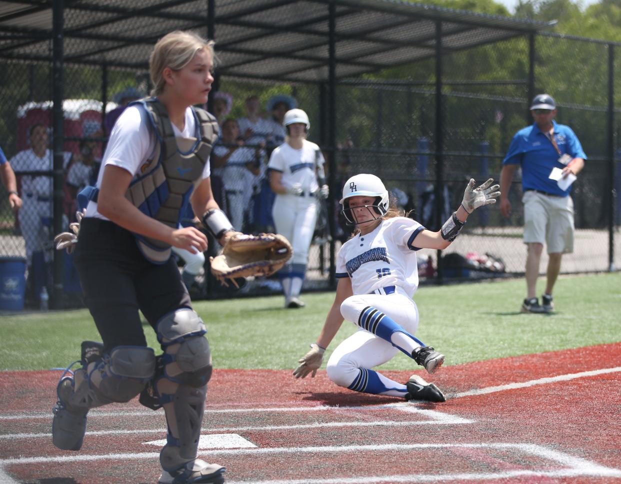 Deposit-Hancock's Kaitlyn Macumber slides into home plate as Friendship-Scio's Morghyn Ross covers the plate during the Class D New York State Softball Championship on June 10, 2023.
