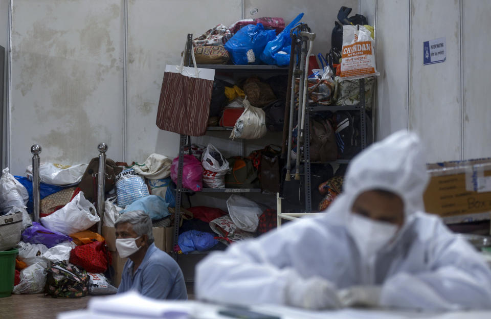 Belongings of patients are seen at the BKC jumbo field hospital, one of the largest COVID-19 facilities in Mumbai, India, Thursday, May 6, 2021.(AP Photo/Rafiq Maqbool)