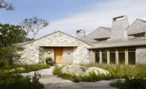 <p> For a front yard that puts Mother Nature in the spotlight, embrace your space’s natural features. Here, architectural and design firm Ike Kligerman Barkley planted tall grass and leafy greens around the yard’s large rocks. Paired with a wide, stone walkway, this front yard strikes a balance between organic and manmade – and, importantly, echoes the materials of the exterior of the house for a cohesive look. </p>