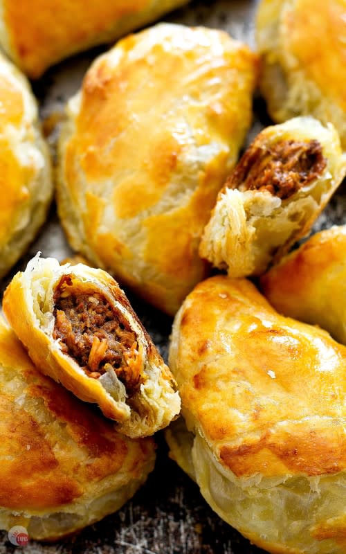 <p>Take Two Tapas</p><p>Full of rich mole sauce and shredded chicken, baked in a fluffy puff pastry shell.</p><p><strong>Get the recipe: </strong><a href="https://www.taketwotapas.com/chicken-mole-empanadas/" rel="nofollow noopener" target="_blank" data-ylk="slk:Dark Chocolate Mole Empanadas;elm:context_link;itc:0;sec:content-canvas" class="link ">Dark Chocolate Mole Empanadas</a></p>