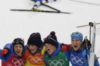 Biathlon - Pyeongchang 2018 Winter Olympics - Women's 4x6 km Relay Final - Alpensia Biathlon Centre - Pyeongchang, South Korea - February 22, 2018 - Bronze medalists Anais Chevalier, Marie Dorin Habert, Justine Braisaz and Anais Bescond of France celebrate. REUTERS/Murad Sezer