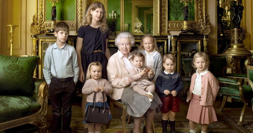 <p>We can't handle the amount of cuteness in this photo! Queen Elizabeth II is surrounded by her great grandchildren including George in a navy cardigan and red shorts. [Photo: Annie Leibovitz] </p>