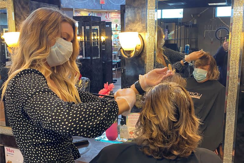 Hairdresser Rachel Costello works at the Three-13 Salon, Spa & Boutique in Marietta