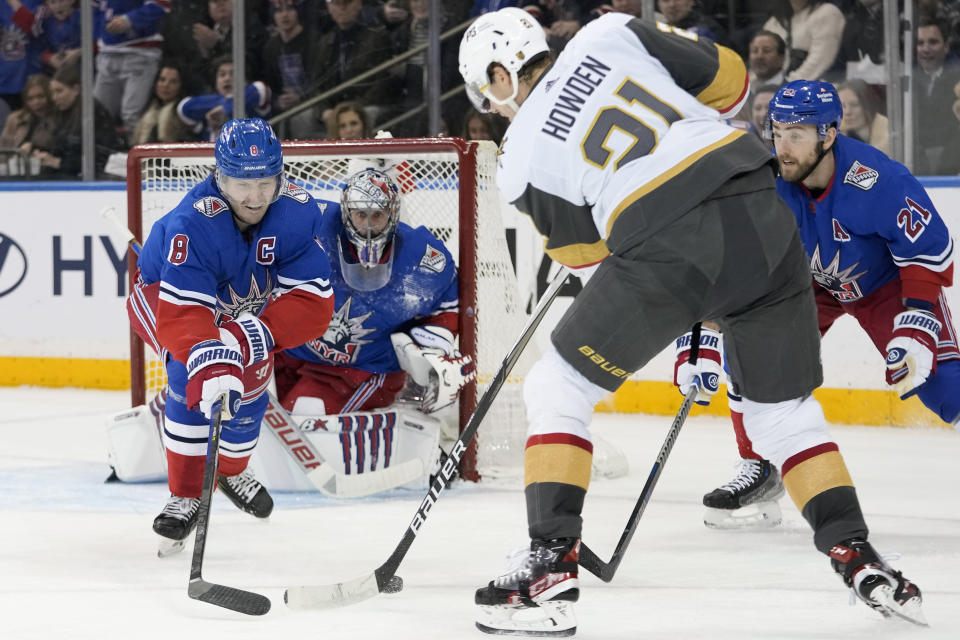 New York Rangers defenseman Jacob Trouba (8) and goaltender Jaroslav Halak (41) defend against Vegas Golden Knights center Brett Howden (21) during the second period of an NHL hockey game Friday, Jan. 27, 2023, at Madison Square Garden in New York. (AP Photo/Mary Altaffer)