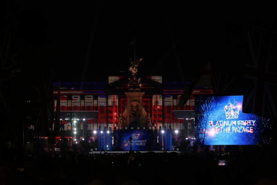 LONDON, ENGLAND - JUNE 04: A light show is projected onto Buckingham Palace during the Platinum Party At The Palace concert on June 4, 2022 in London, United Kingdom. The Platinum Jubilee of Elizabeth II is being celebrated from June 2 to June 5, 2022, in the UK and Commonwealth to mark the 70th anniversary of the accession of Queen Elizabeth II on 6 February 1952. (Photo by Hollie Adams/Getty Images)