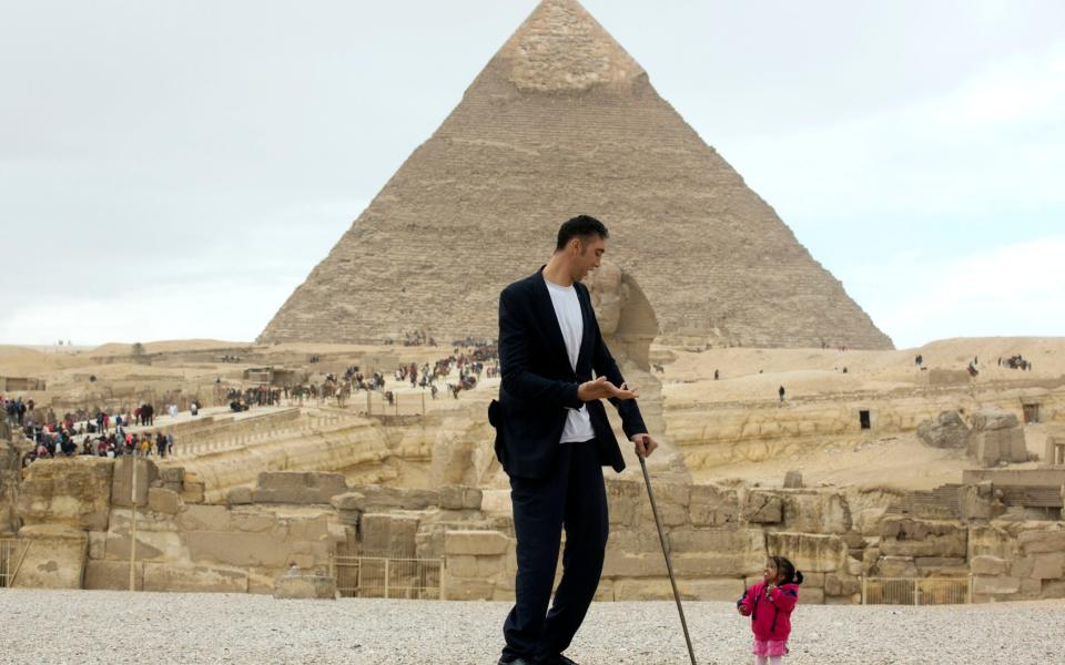 Sultan Kosen, a 34-year-old Turk, the world's tallest man according to the Guinness Book of Records, with a height of 246.5 cm (8 ft 1 in), talks to Jyoti Amge