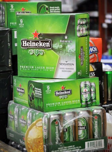 Boxes of Dutch beer Heineken displayed at a convenience store in Singapore. A Thai company raised the stakes in a battle for control of a Singapore brewer about to be taken over by Dutch giant Heineken by offering a higher price for the makers of Tiger Beer