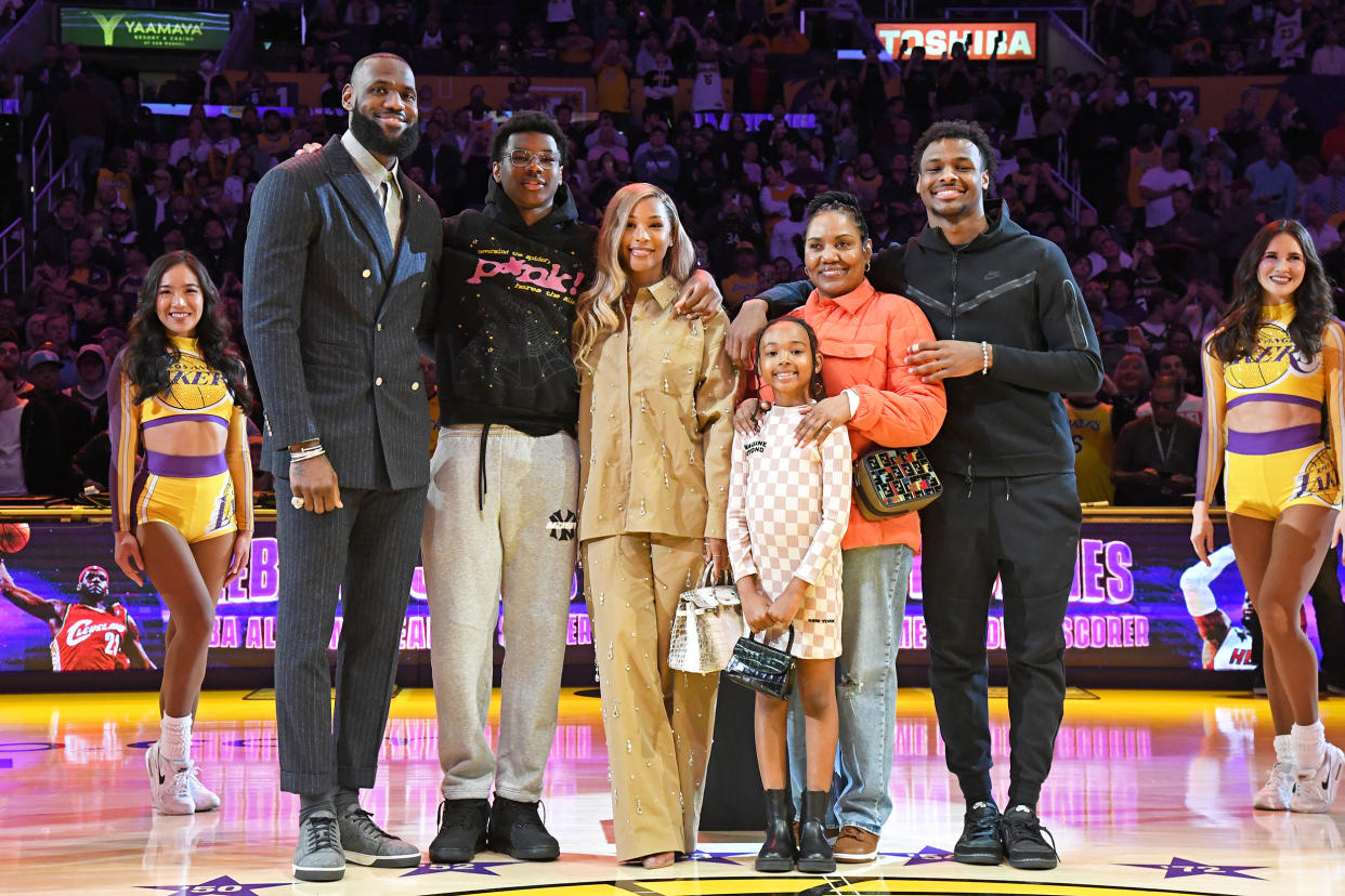 LeBron James and his family poses for a photo during a ceremony to honor him becoming the NBA All Time Leading Scorer before the game against the Milwaukee Bucks on February 9, 2023 at Crypto.Com Arena in Los Angeles, California. (Andrew D. Bernstein / NBAE via Getty Images file)