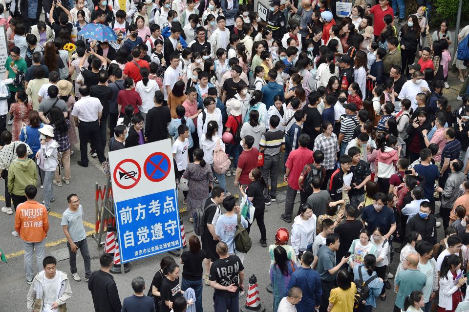 Students leave after their first exam during the first day of the National College Entrance Examination (NCEE), known as "gaokao", in Nanjing, in China's eastern Jiangsu province on June 7, 2023.