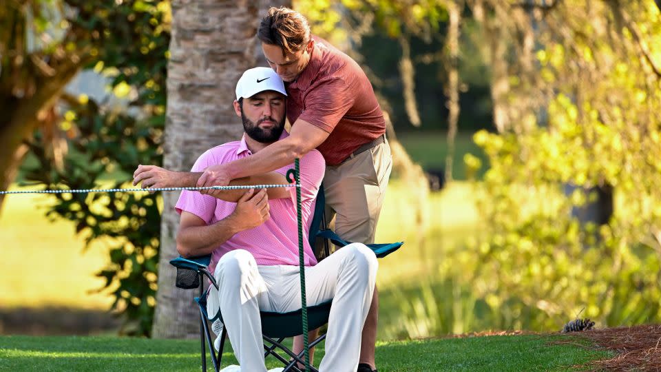 A physiotherapist treats Scheffler. - Ben Jared/PGA TOUR/Getty Images