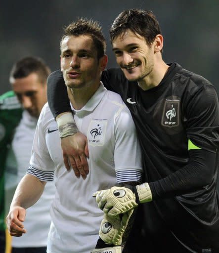 French captain Hugo Lloris (R) and defender Mathieu Debuchy react after the International friendly football match Germany vs France in the northern German city of Bremen. France won 2-1