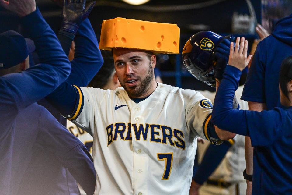 Milwaukee Brewers catcher Victor Caratini (7) is greeted in the dugout after hitting a two-run home run in the third inning against the Detroit Tigers at American Family Field in Milwaukee on Wednesday, April 26, 2023.