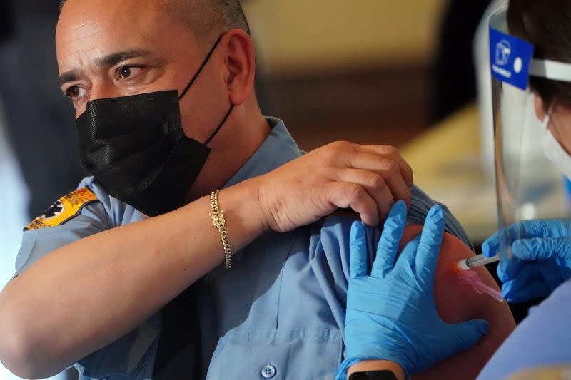 Workers of the FDNY EMS receive COVID-19 Moderna vaccine in New York