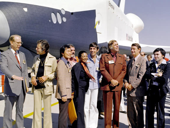 In 1976, NASA's space shuttle Enterprise rolled out of the Palmdale manufacturing facilities and was greeted by NASA officials and cast members from the 'Star Trek' television series. From left to right they are: NASA Administrator Dr. James D.