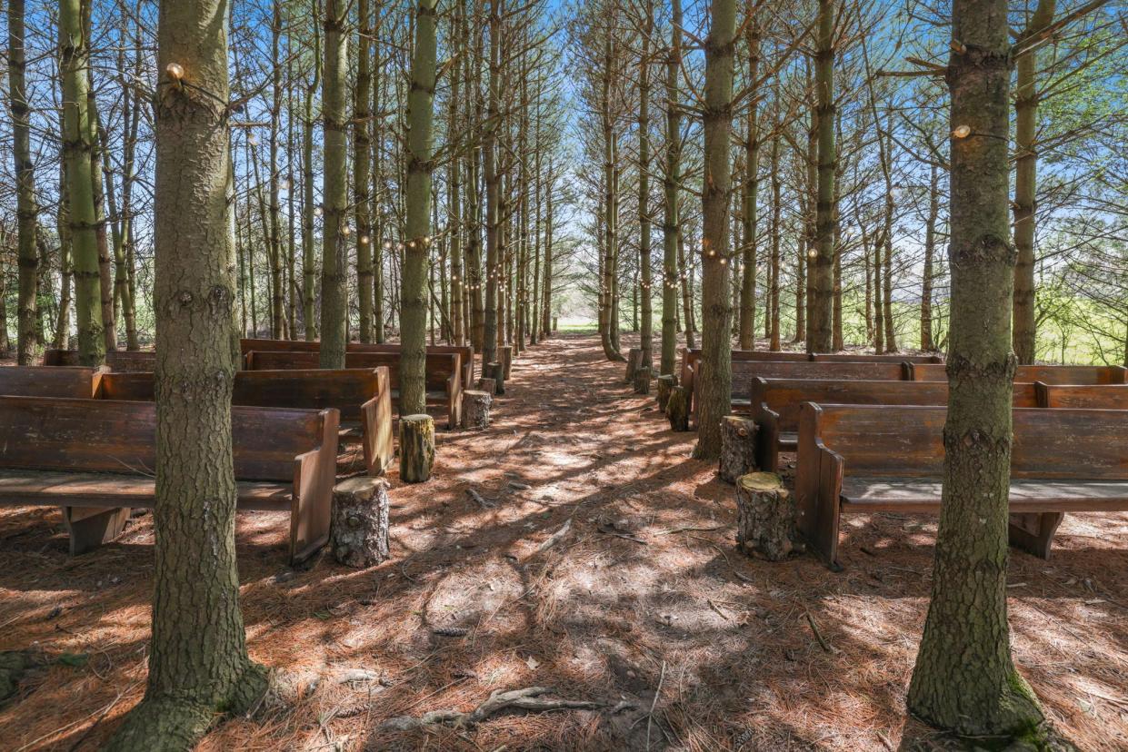 Dean Lowry and Jodi Melfi built a wedding chapel in a stand of pine trees behind their Orchard House property.