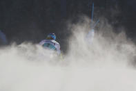 United States' Mikaela Shiffrin speeds down the course during an alpine ski an alpine ski, women's World Cup super-G in St. Moritz, Switzerland, Sunday, Dec. 12, 2021. (AP Photo/Marco Tacca)