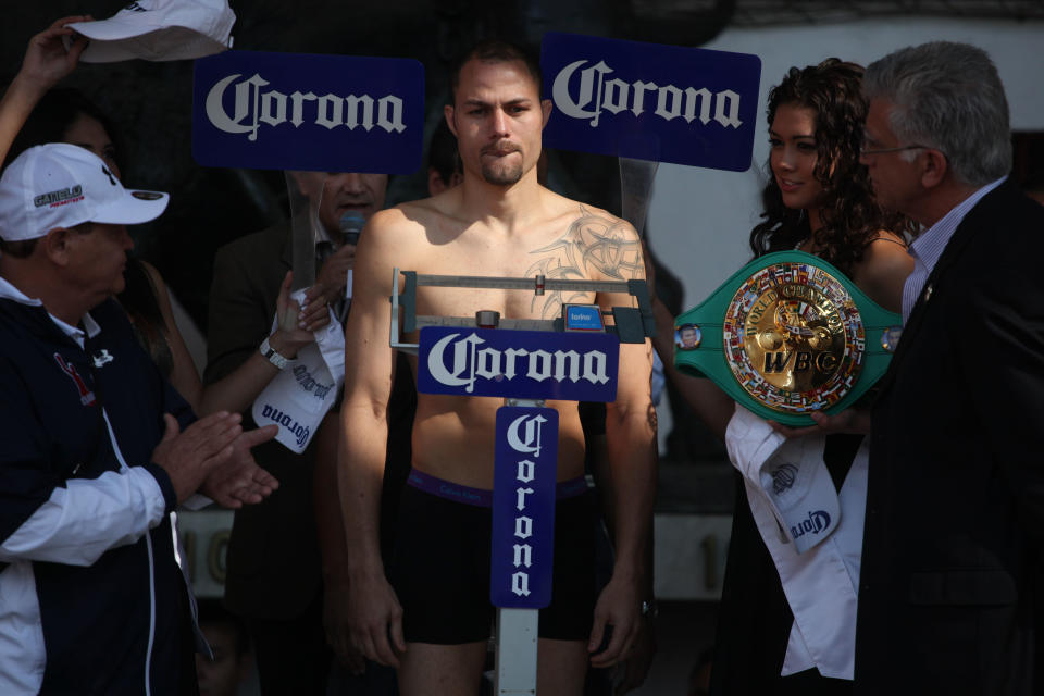 Boxer Kermit Cintron, of Puerto Rico, stands on the scales during the weigh-in ceremony in Mexico City, Friday, Nov. 25, 2011. Cintron will fight Saul Canelo Alvarez, of Mexico, for the WBC super welterweight title at the Plaza de Toros Mexico on Saturday. (AP Photo/Alexandre Meneghini)
