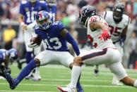 Sep 23, 2018; Houston, TX, USA; New York Giants receiver Odell Beckham Jr. (13) runs after a reception against Houston Texans safety Tyrann Mathieu (32) at NRG Stadium. Mandatory Credit: Matthew Emmons-USA TODAY Sports