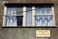 A placard reading "Umpteenth death for pulmonary neoplasm" in seen next the window of an house in the Tamburi district, in Taranto, southern Italy April 27, 2018. Picture taken April 27, 2018. REUTERS/Tony Gentile