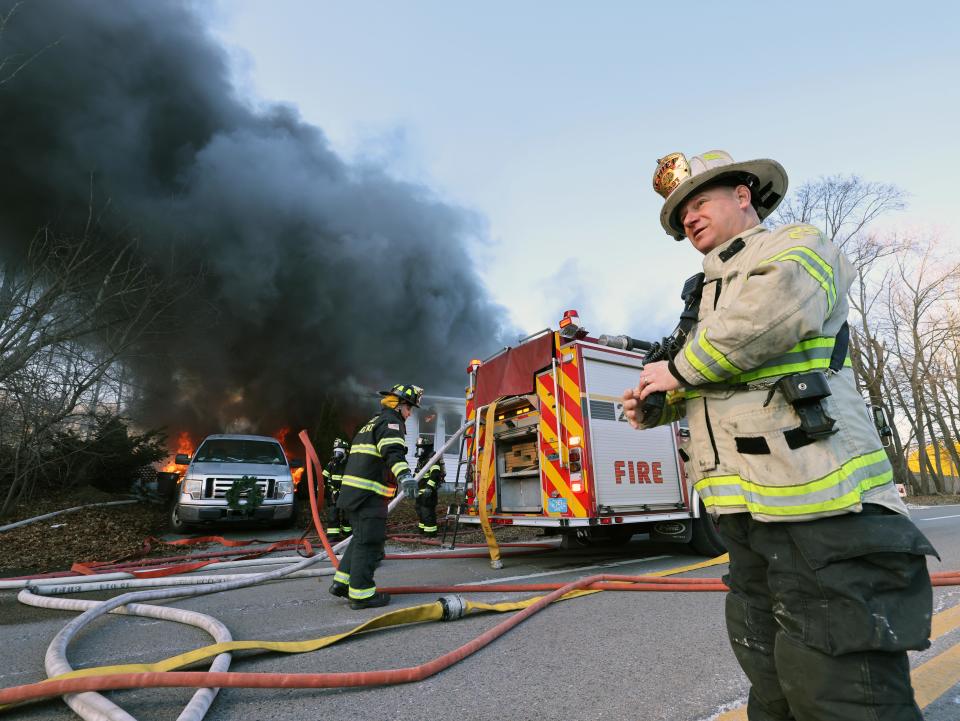 East Bridgewater Fire Chief Timothy Harhen is on scene as firefighters from multiple communities battle a two-alarm house fire at 53 Old Bedford Road in East Bridgewater on Sunday, Feb. 4, 2024.