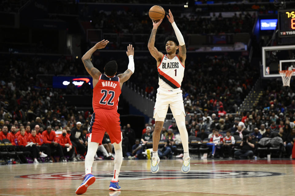 Portland Trail Blazers guard Anfernee Simons (1) shoots against Washington Wizards guard Monte Morris (22) during the second half of an NBA basketball game, Friday, Feb. 3, 2023, in Washington. The Trail Blazers won 124-116. (AP Photo/Nick Wass)