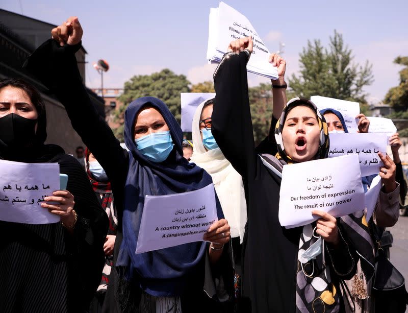 FILE PHOTO: Afghan women's rights defenders and civil activists protest to call on the Taliban for the preservation of their achievements and education, in front of the presidential palace in Kabul