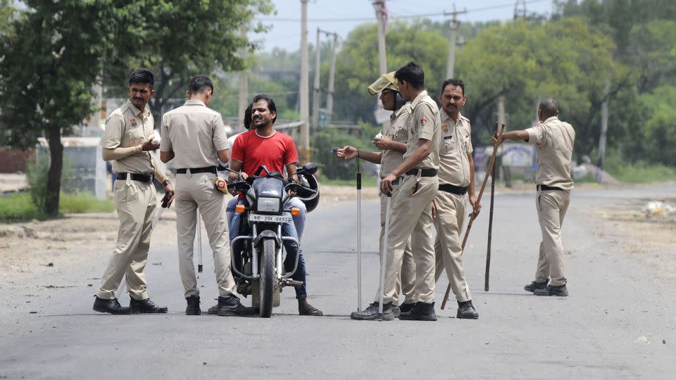 Haryana Police conduct checks near Nuh Chowk on August 1, 2023 in Gurugram, India.  - Parveen Kumar/Hindustan Times/Getty Images