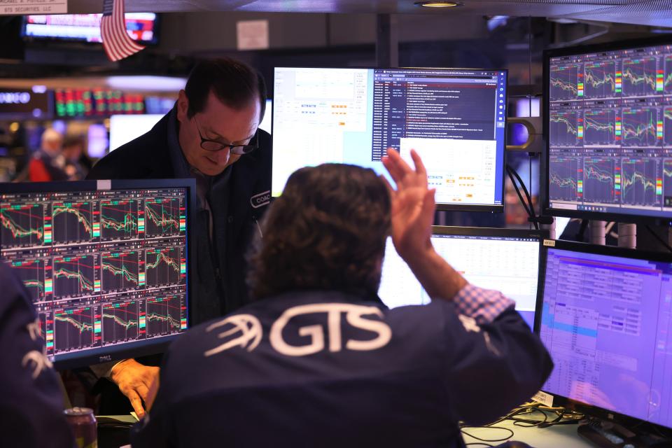 Traders work on the floor of the New York Stock Exchange during morning trading on March 13, 2023, in New York City. Stocks continued their downward trend following the financial news of the failure of Silicon Valley Bank, the biggest U.S. bank failure since the financial crisis in 2008, and the government stepping in to support the banking system after the collapse sparked fears of a ripple effect.