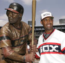 FILE - In this July 20, 2008, file photo, Chicago White Sox first base coach Harold Baines poses with his life-sized sculpture during a ceremony before their baseball game against the Kansas City Royals, in Chicago. Baines will be inducted into the Baseball Hall of Fame on Sunday, July 21, 2019. (AP Photo/Nam Y. Huh, File)