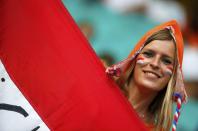 A Netherlands fan poses before the 2014 World Cup quarter-finals between Costa Rica and the Netherlands at the Fonte Nova arena in Salvador July 5, 2014. REUTERS/Sergio Moraes