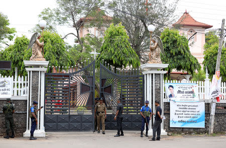 Police and security personnel stand guard outside St Sebastian's Church in Negombo, Sri Lanka April 26, 2019. REUTERS/Athit Perawongmetha