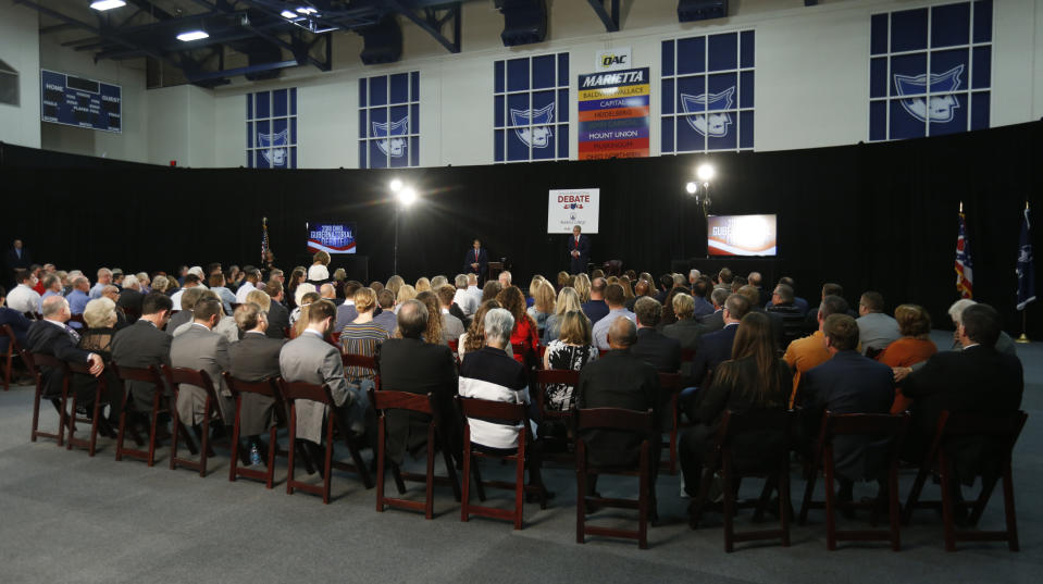 The audience is seen during a debate between Democratic gubernatorial candidate Richard Cordray and Ohio Attorney General and Republican gubernatorial candidate Mike DeWine at Marietta College in Marietta, Ohio, Monday, Oct. 1, 2018. (AP Photo/Paul Vernon, Pool)