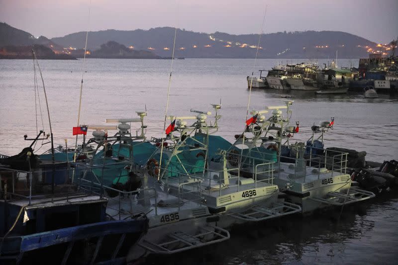Taiwanese flags flutter on coast guard boats at a port on Nangan island