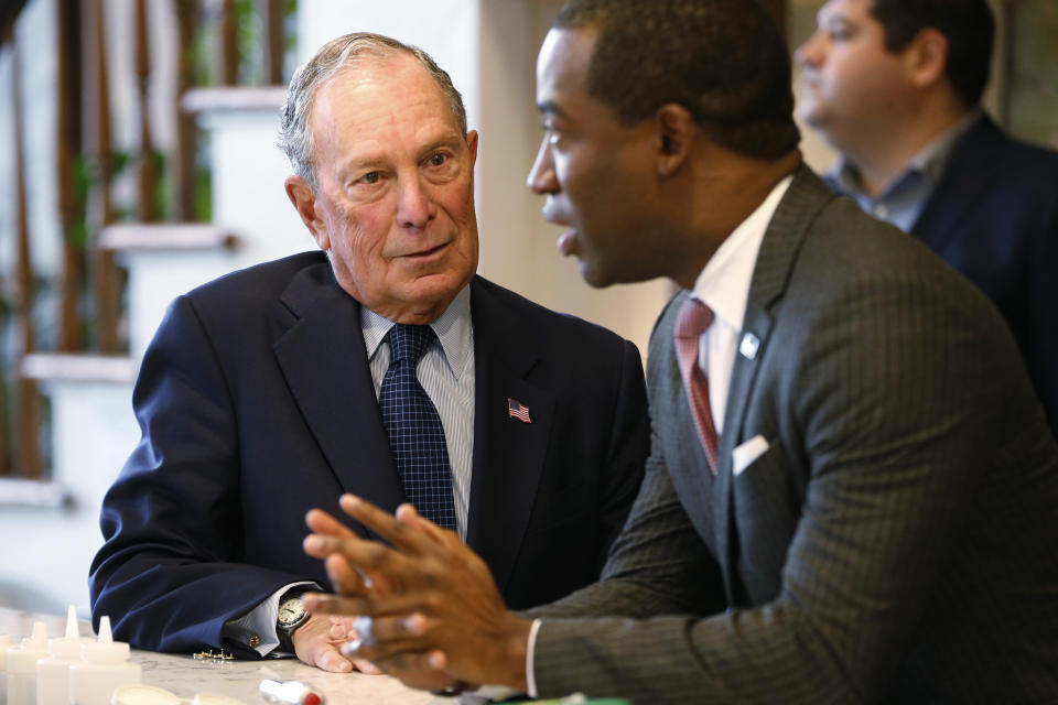 Democratic presidential candidate, former New York Mayor Michael Bloomberg, left, chats with Richmond mayor, Levar Stoney, at a coffee shop in Richmond, Va., Tuesday, Jan. 7, 2020. (AP Photo/Steve Helber)