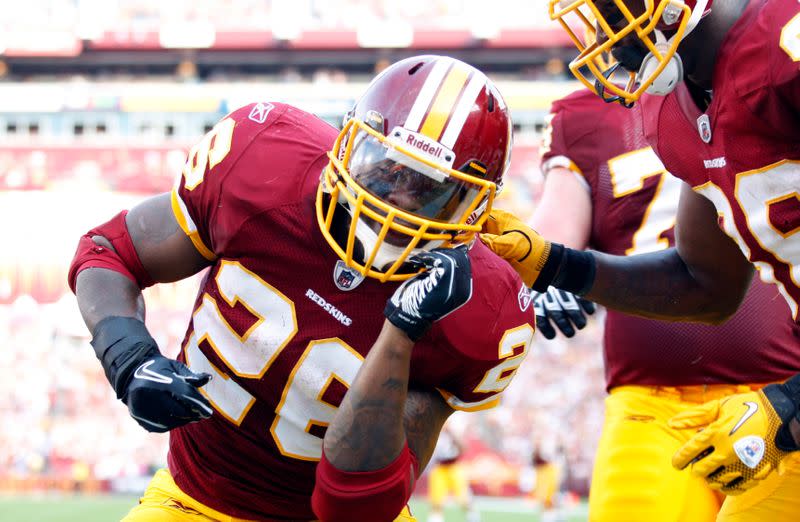 FILE PHOTO: Washington Redskins Clinton Portis celebrates his second touchdown in the second quarter against the Houston Texans during their NFL football game in Landover