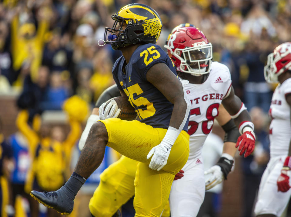 Michigan running back Hassan Haskins (25) celebrates after scoring a touchdown in the second quarter of an NCAA college football game against Rutgers in Ann Arbor, Mich., Saturday, Sept. 25, 2021. (AP Photo/Tony Ding)